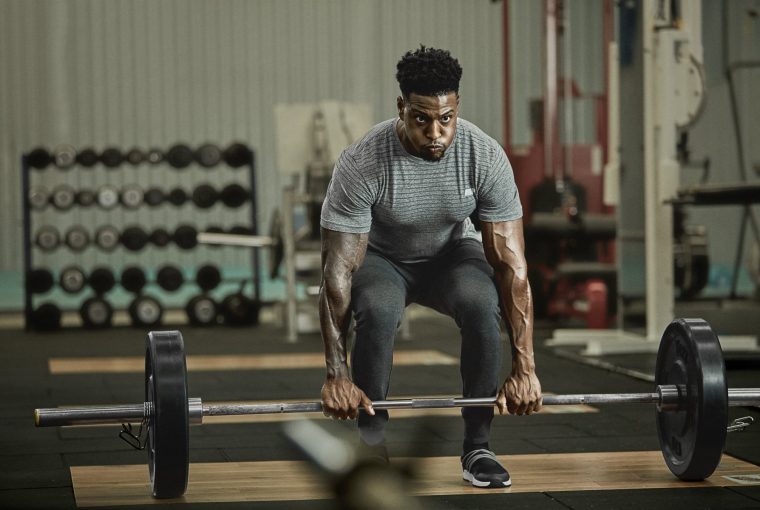 a strong man doing deadlifts
