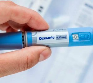 a person holding an ozempic pen