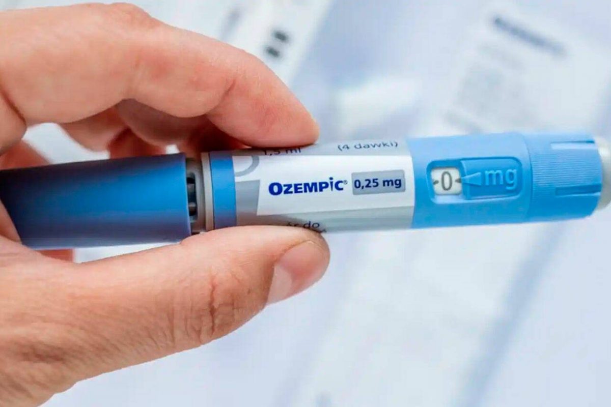 a person holding an ozempic pen