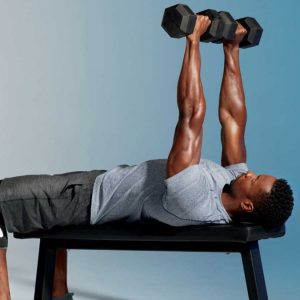 a man doing chest press with dumbbells
