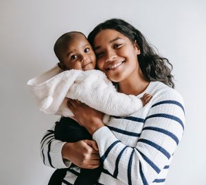 a woman holding her baby