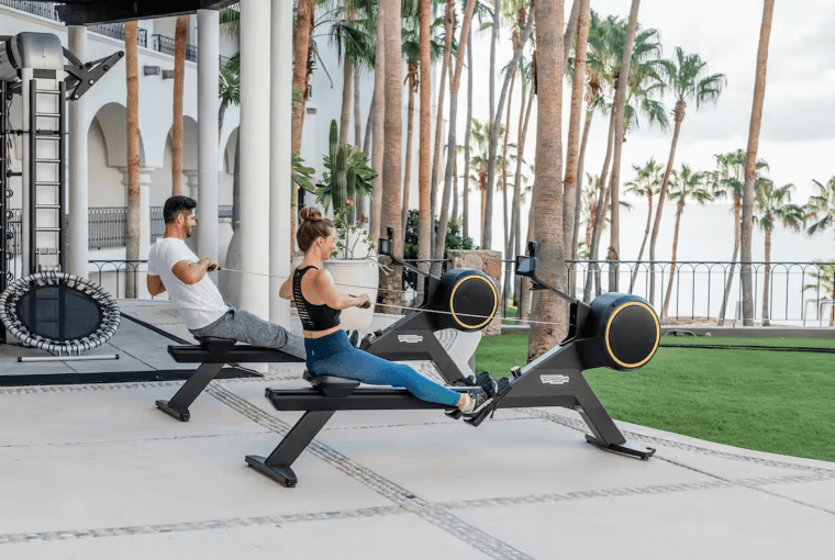 a couple working outdoors in a resort space