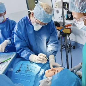 a group of surgeons working on a patient