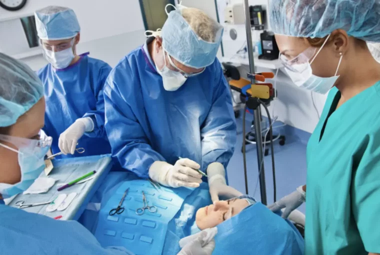 a group of surgeons working on a patient