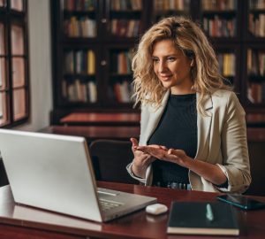 a woman at a computer in a library