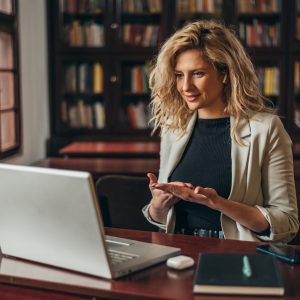 a woman at a computer in a library