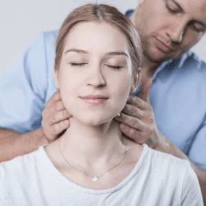 a woman receiving a neck adjustment