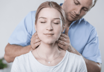 a woman receiving a neck adjustment