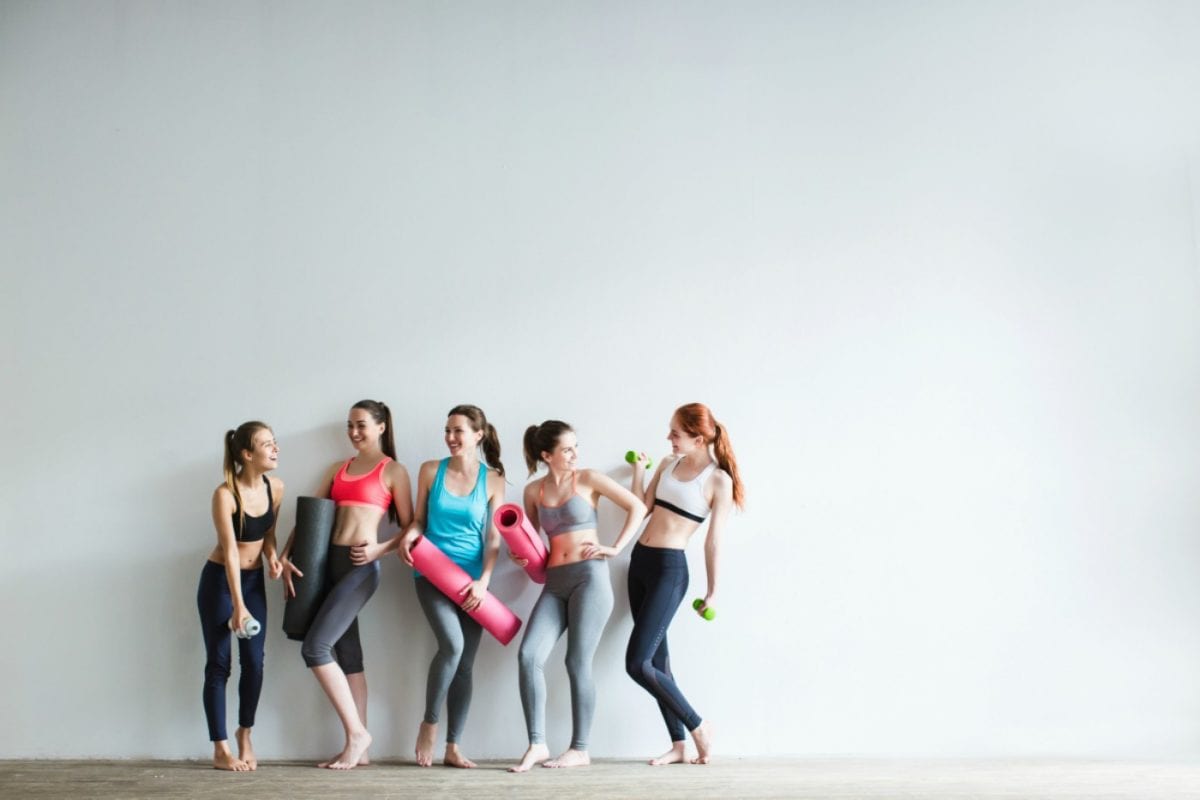 a group of women in a yoga studio