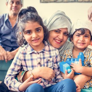a happy family smiling at the camera