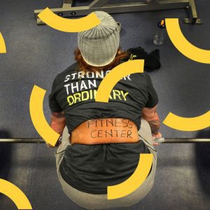 a woman with a weight belt on bent over