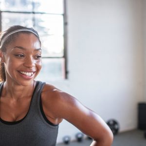 A woman smiling after a good workout