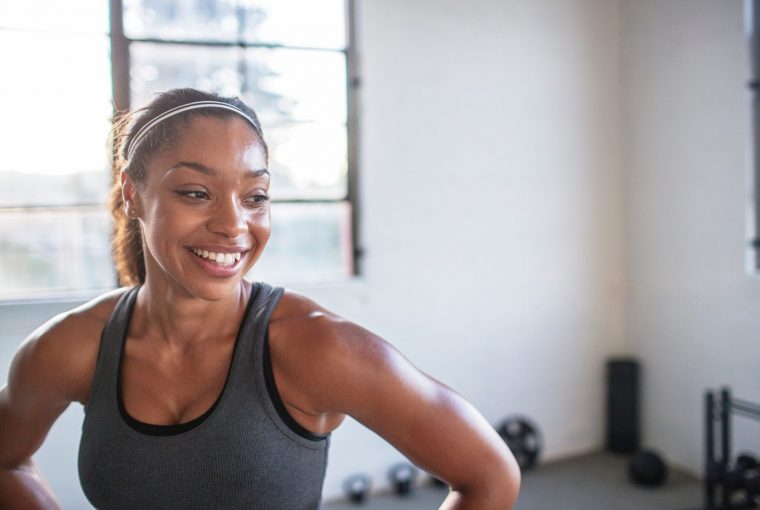 A woman smiling after a good workout
