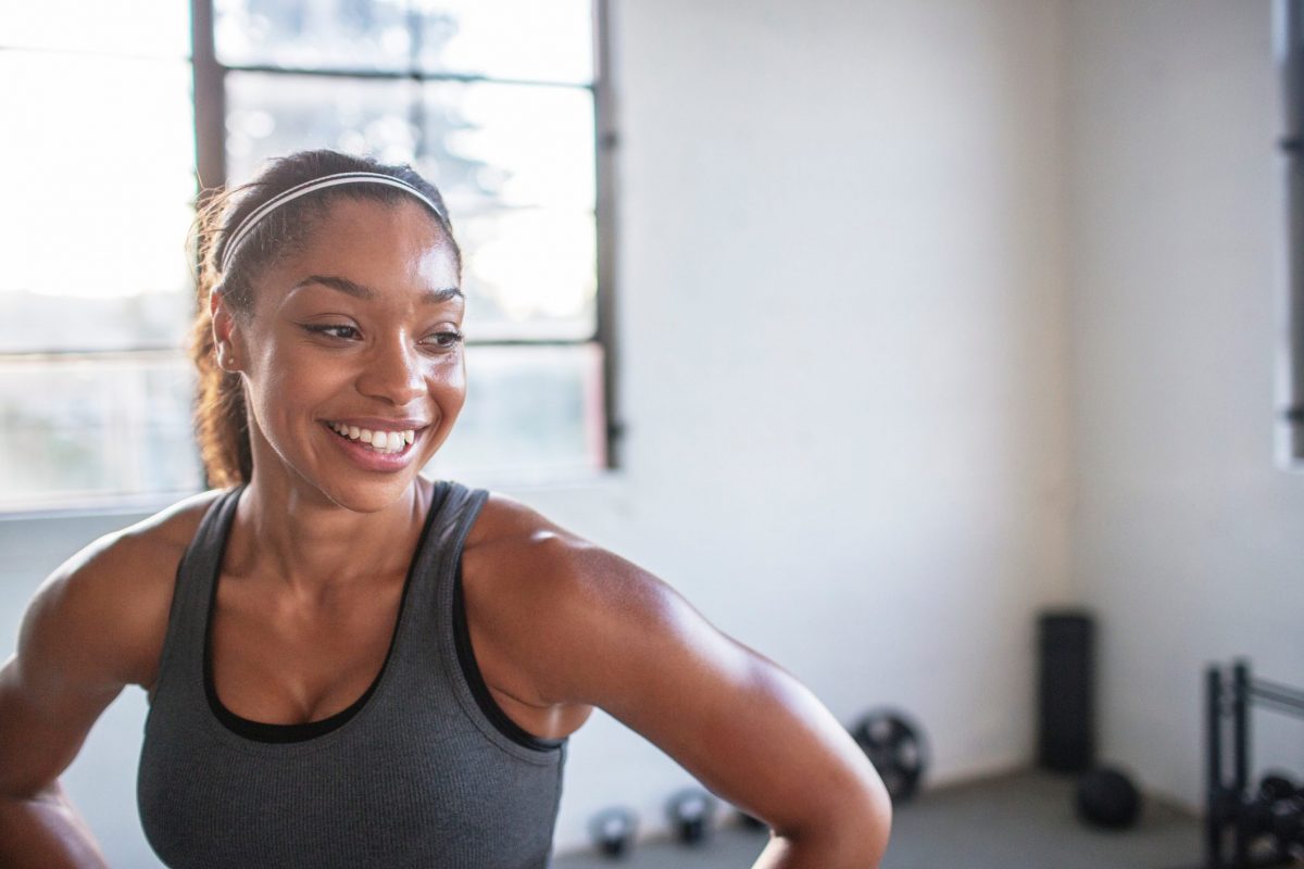A woman smiling after a good workout