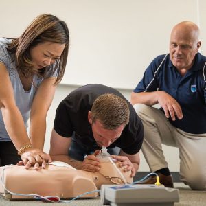 an instructor showing students first aid