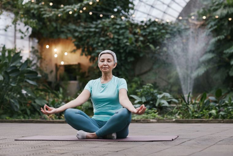 a woman in lotus position meditating