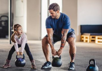 a father and daughter working out