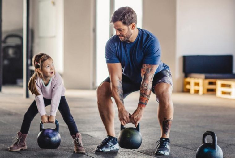 a father and daughter working out