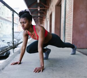 a woman doing a post workout stretch