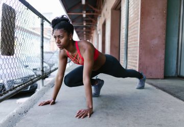 a woman doing a post workout stretch