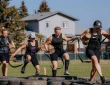 a group of athletes running an obstacle course race