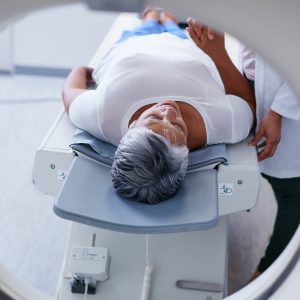 Shot of a senior woman being comforted by a doctor before and MRI