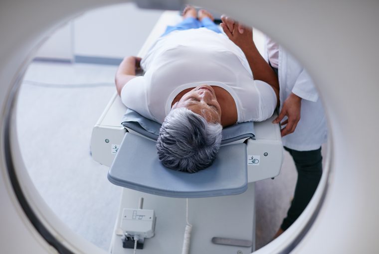 Shot of a senior woman being comforted by a doctor before and MRI