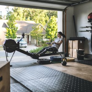 a woman working out in her garage home gym