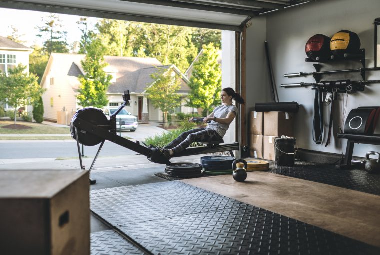 a woman working out in her garage home gym