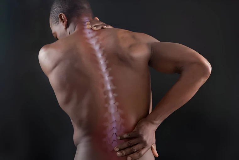 A man holding their sore back