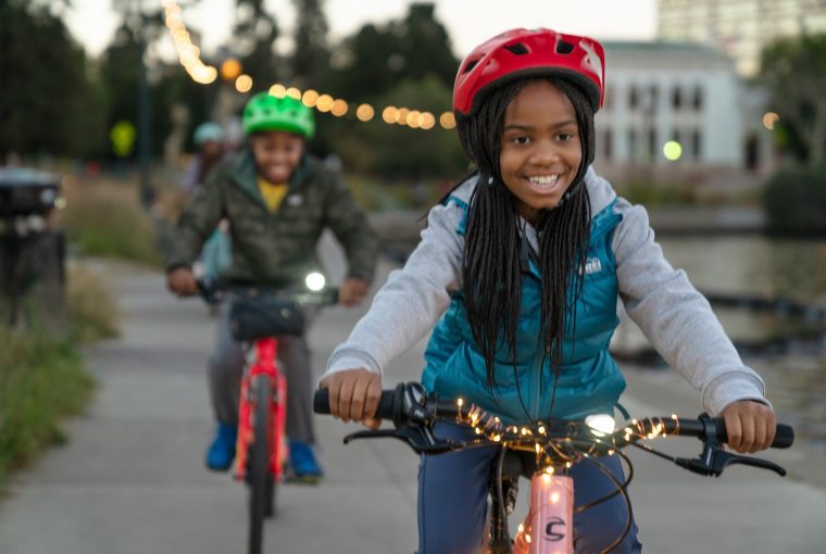 a group of kids riding their bikes