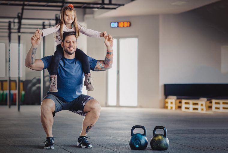 a man and his daughter exercising