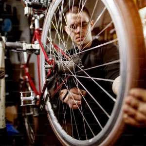 a man doing a bike tune-up