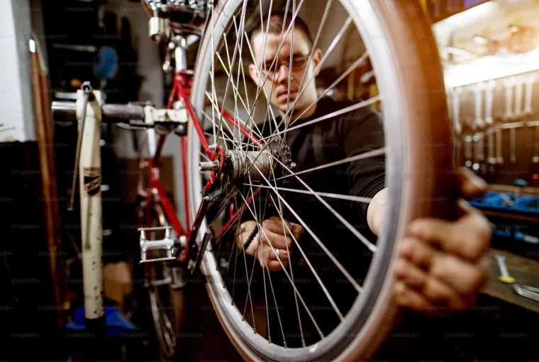 a man doing a bike tune-up