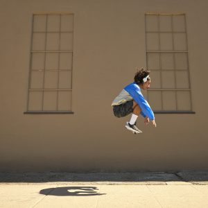 a woman doing squat jumps