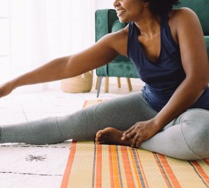 a woman stretching on the floor