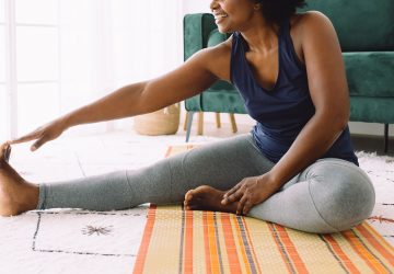 a woman stretching on the floor