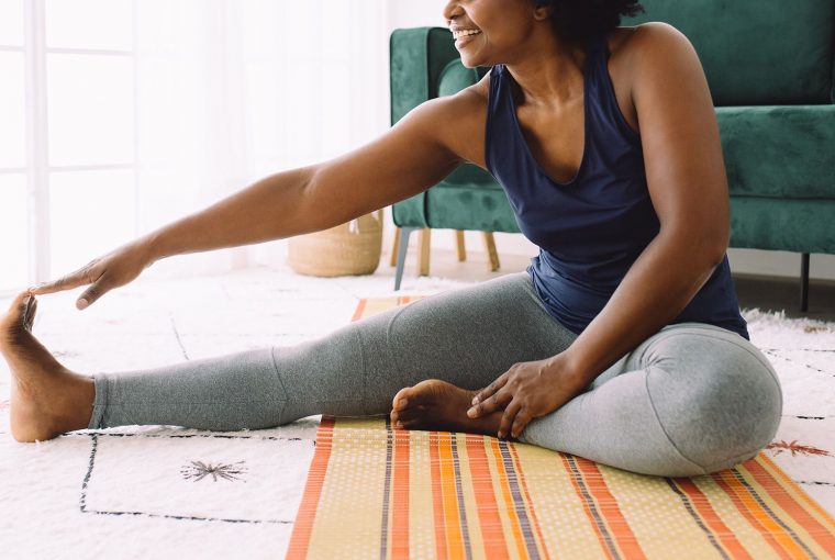 a woman stretching on the floor
