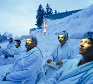 a group of people with lights on their foreheads
