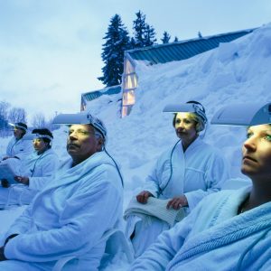 a group of people with lights on their foreheads