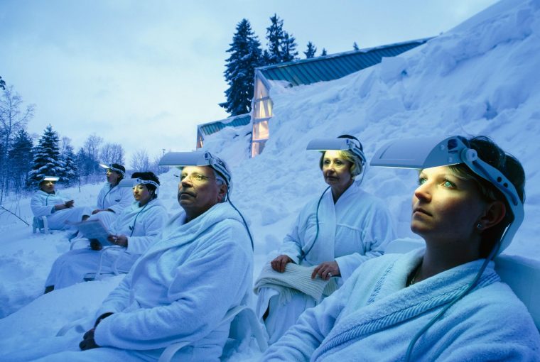 a group of people with lights on their foreheads