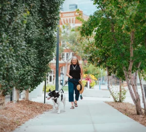 a woman walking with her dog