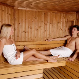 a couple sitting in their home sauna