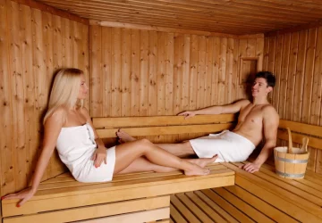 a couple sitting in their home sauna