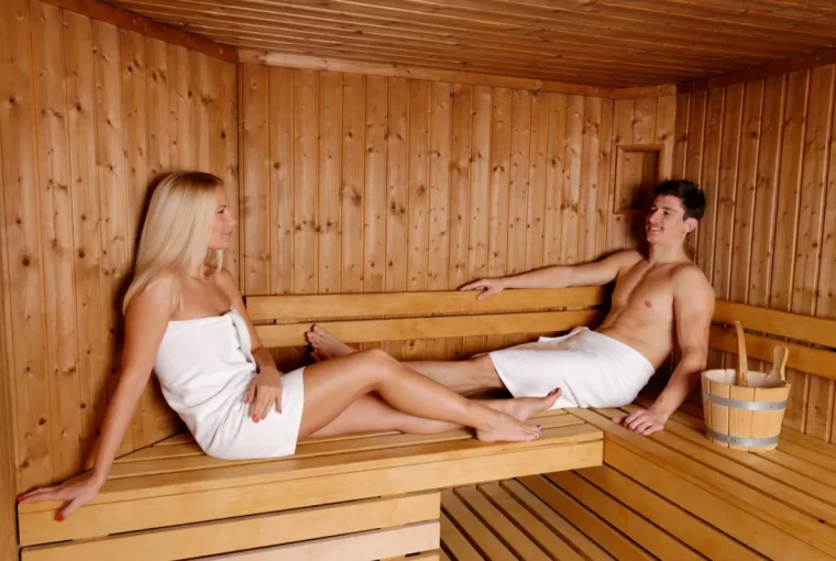 a couple sitting in their home sauna