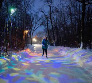 a woman skating in an outdoor rink