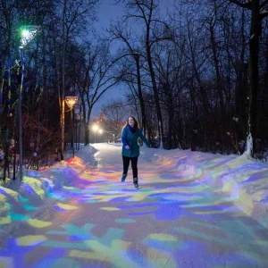 a woman skating in an outdoor rink