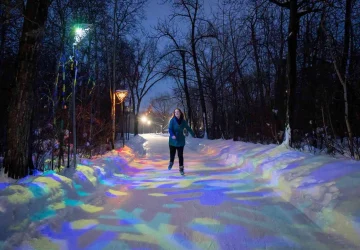 a woman skating in an outdoor rink