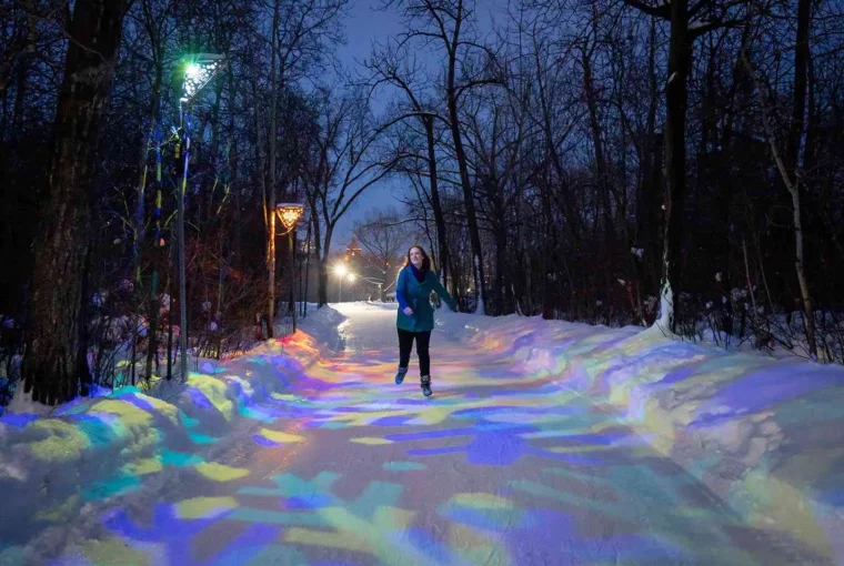a woman skating in an outdoor rink