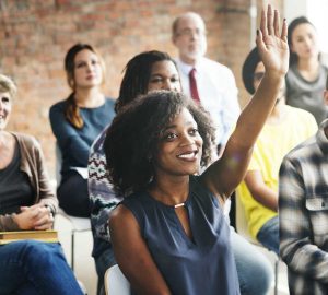 a group of adults in a classroom